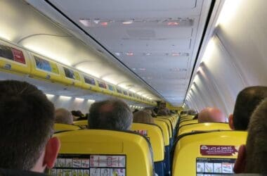 a group of people sitting in an airplane