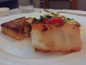 Grilled Black Cod with herbed potato cake.