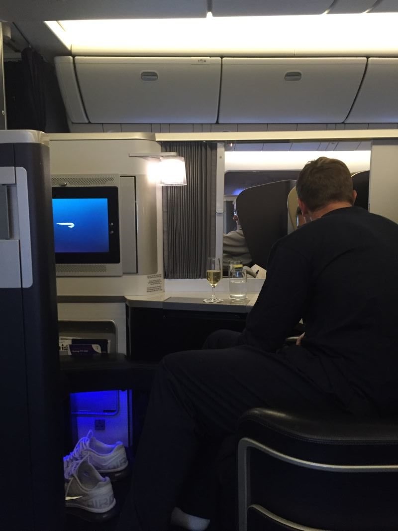 a man sitting in a chair in an airplane