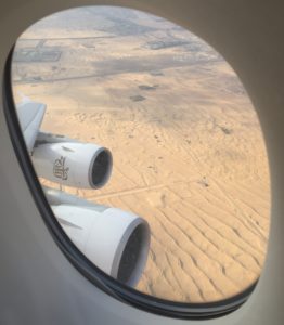 a view of the desert from a window of an airplane