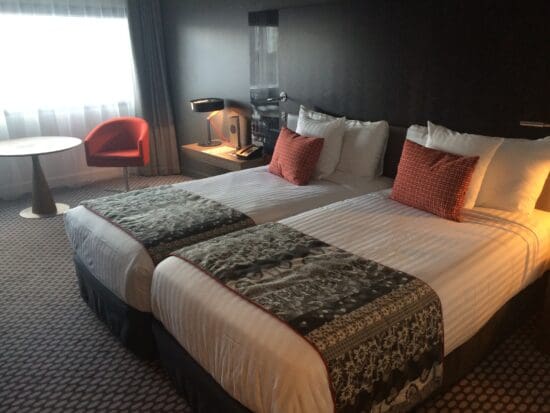 a hotel room with two beds