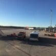 a group of vehicles parked on a tarmac