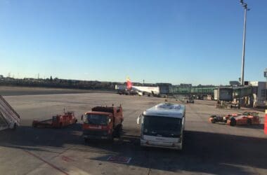 a group of vehicles parked on a tarmac