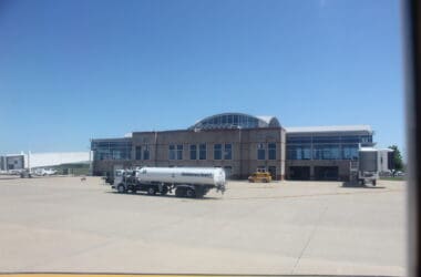 a large building with a large white truck parked outside