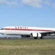 a white and red airplane on a runway