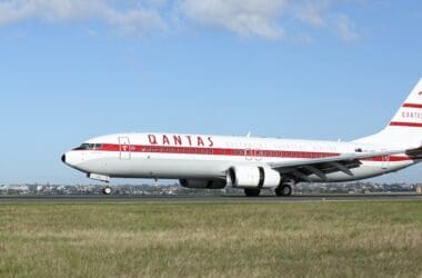 a white and red airplane on a runway