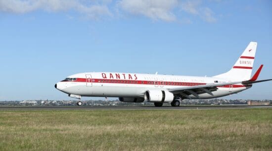 a white and red airplane on a runway