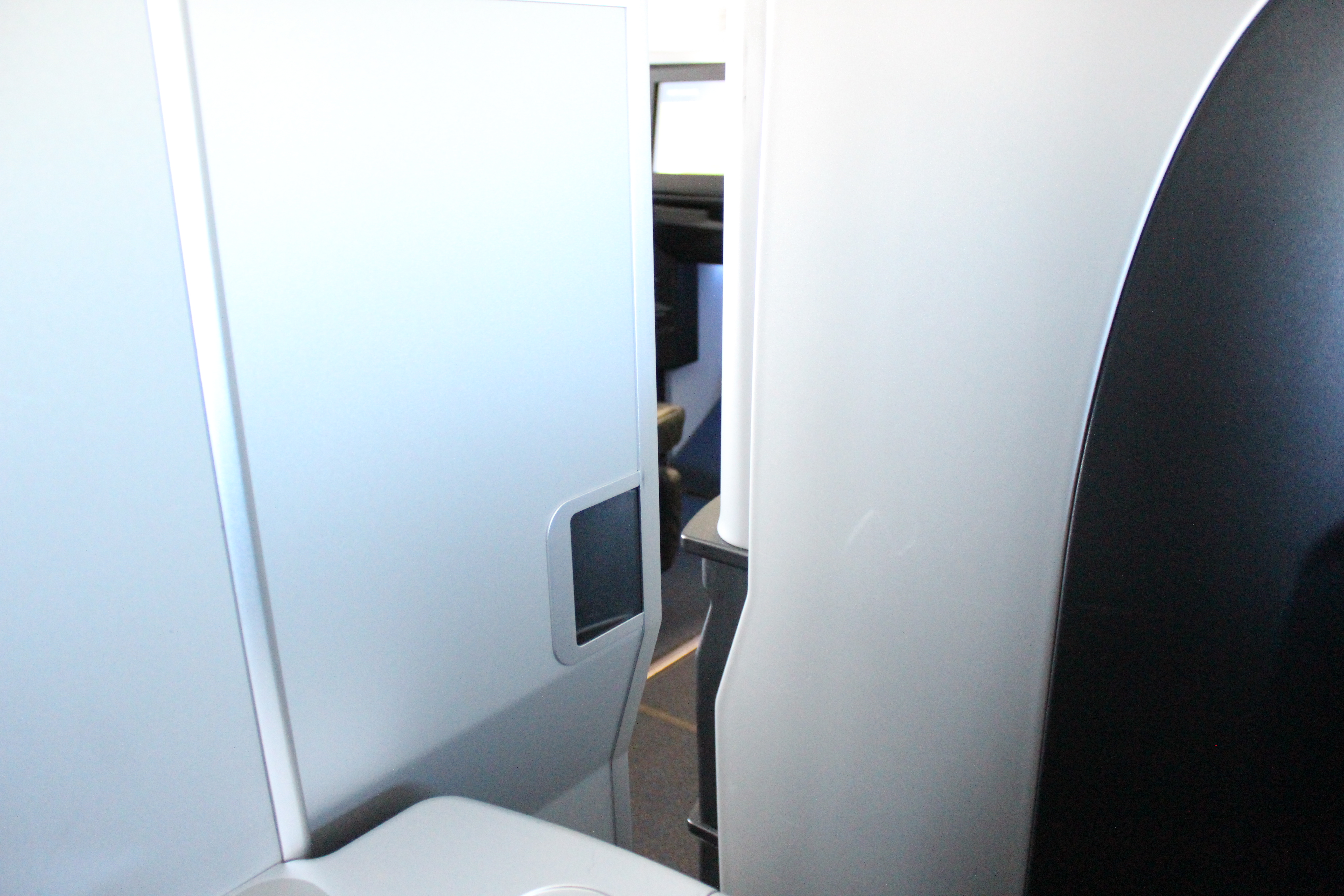 a door and a toilet in an airplane