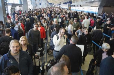 a large crowd of people in an airport