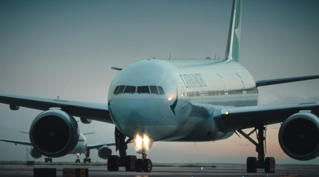 a large white airplane on a runway