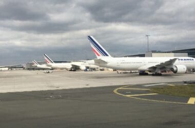 a group of airplanes parked on a runway