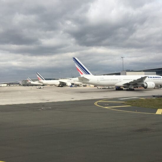 a group of airplanes parked on a runway