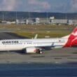 a white and red airplane on a runway