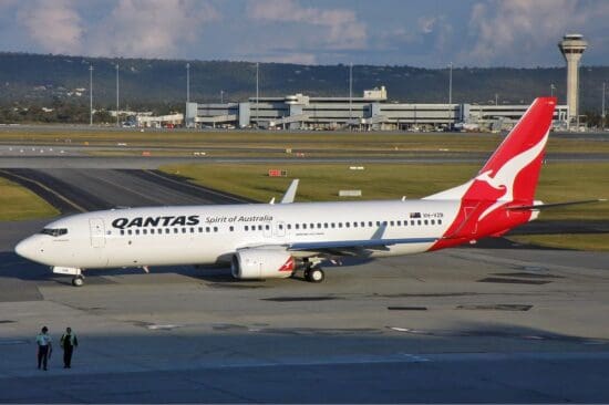 a white and red airplane on a runway