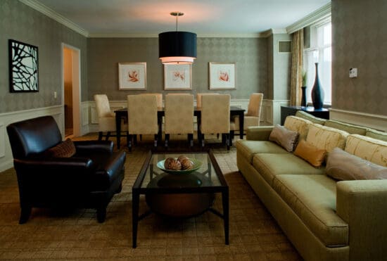 a living room with a table and chairs