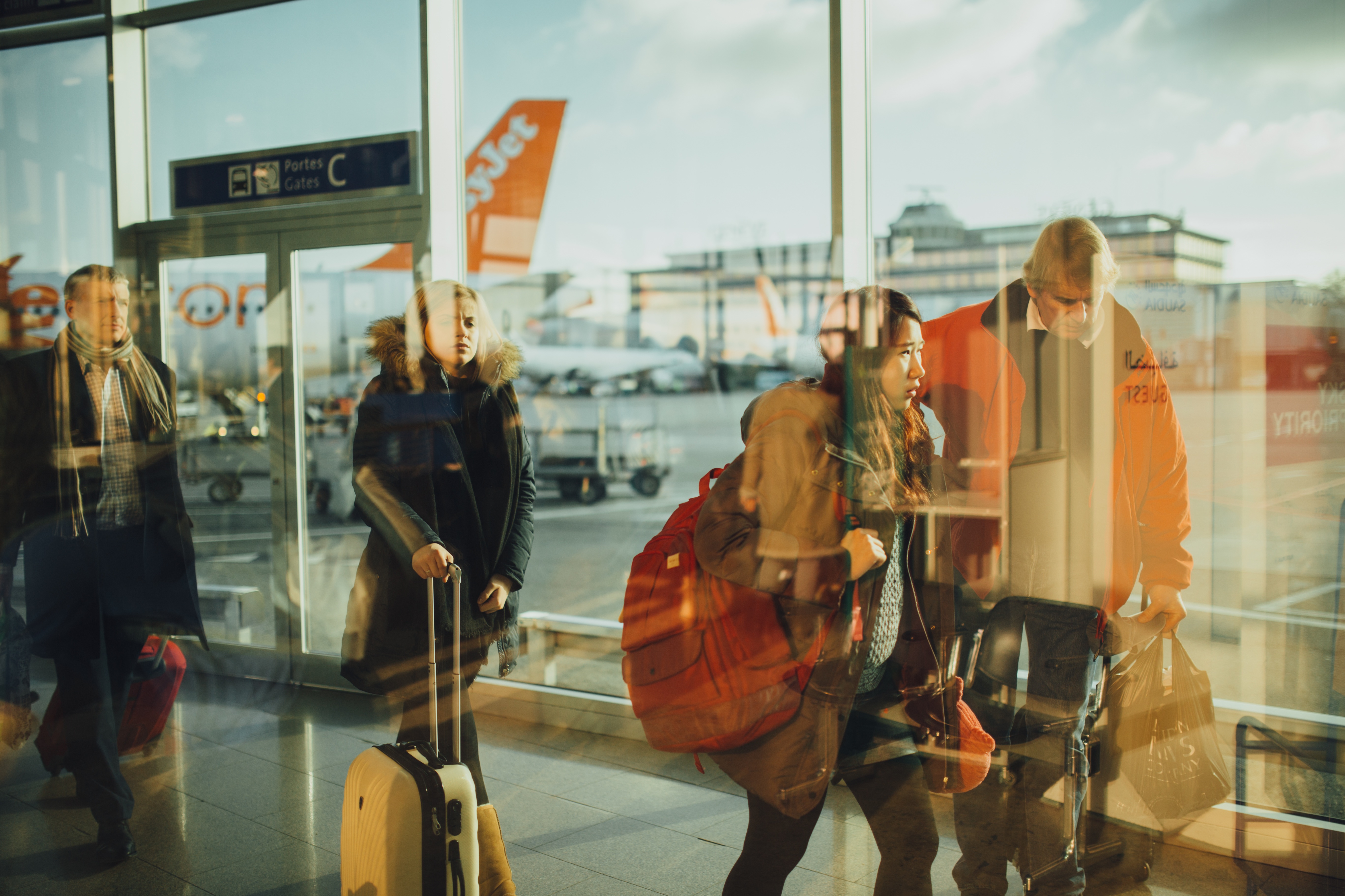 people walking through a window