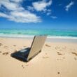 a laptop on a beach