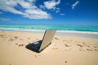 a laptop on a beach