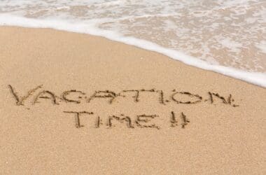 a beach with words written in sand