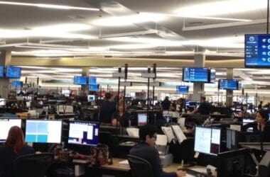 people working at computers in a large room