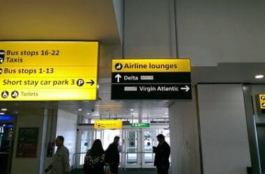 a group of people walking in an airport