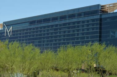 a building with trees in the background