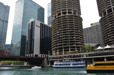 a boat on water next to a building