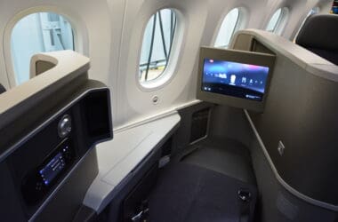 a seat and screen in an airplane