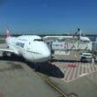 a large white airplane at an airport