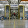 a large hangar with a large airplane