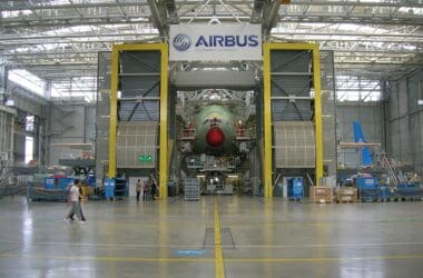 a large hangar with a large airplane
