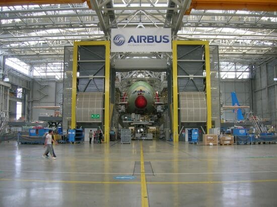 a large hangar with a large airplane