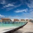 a long wooden walkway leading to a beach