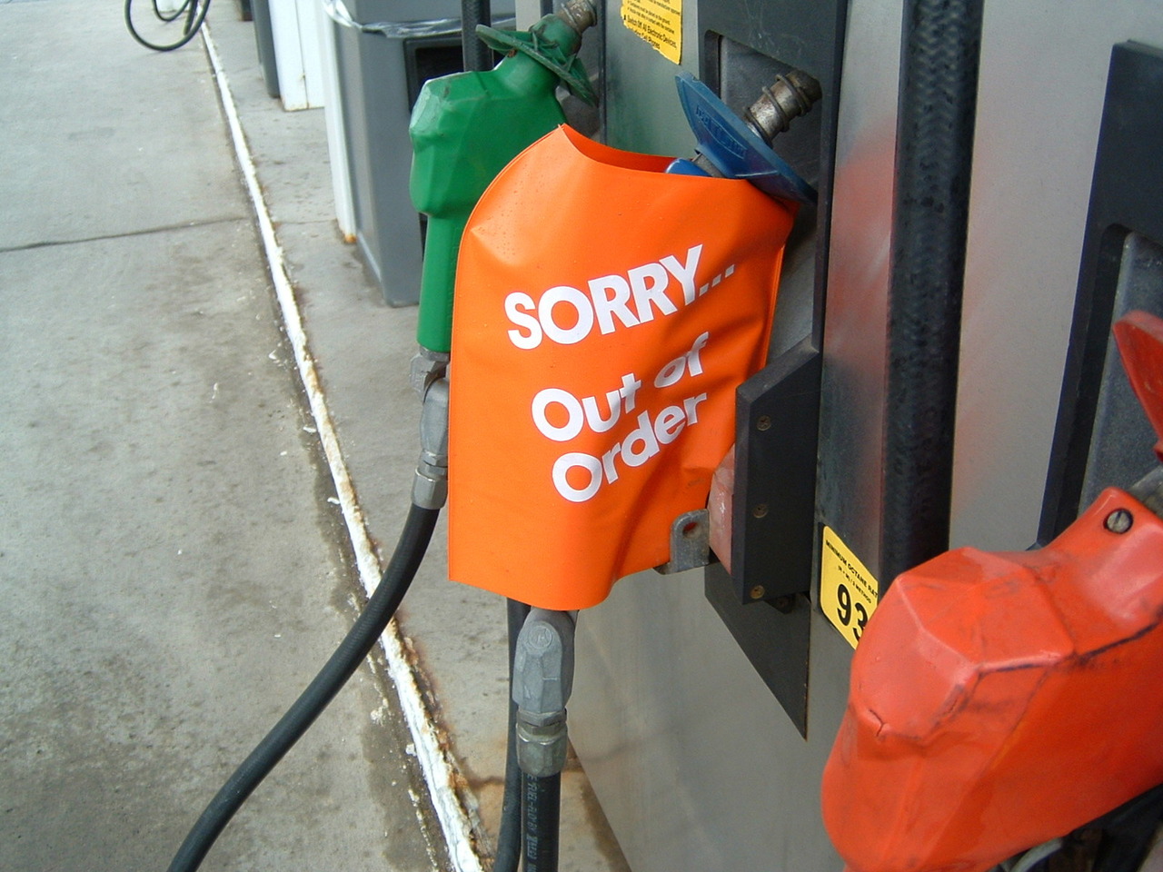 a gas pump with a sign on it