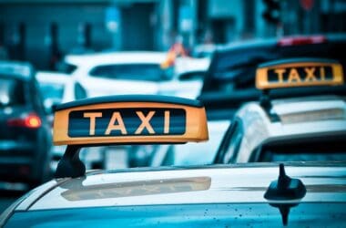 a taxi sign on top of a car