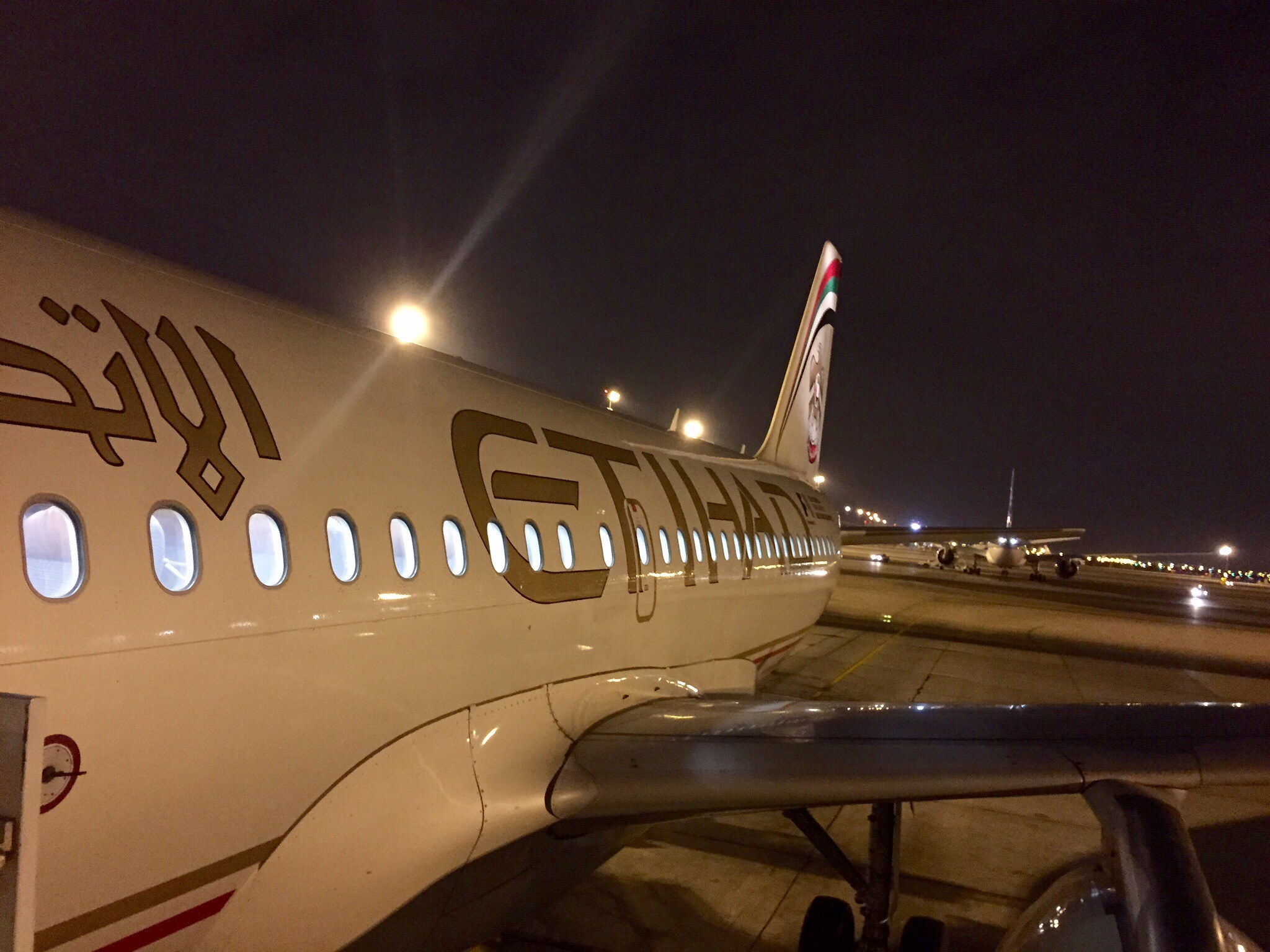 a plane on the runway at night