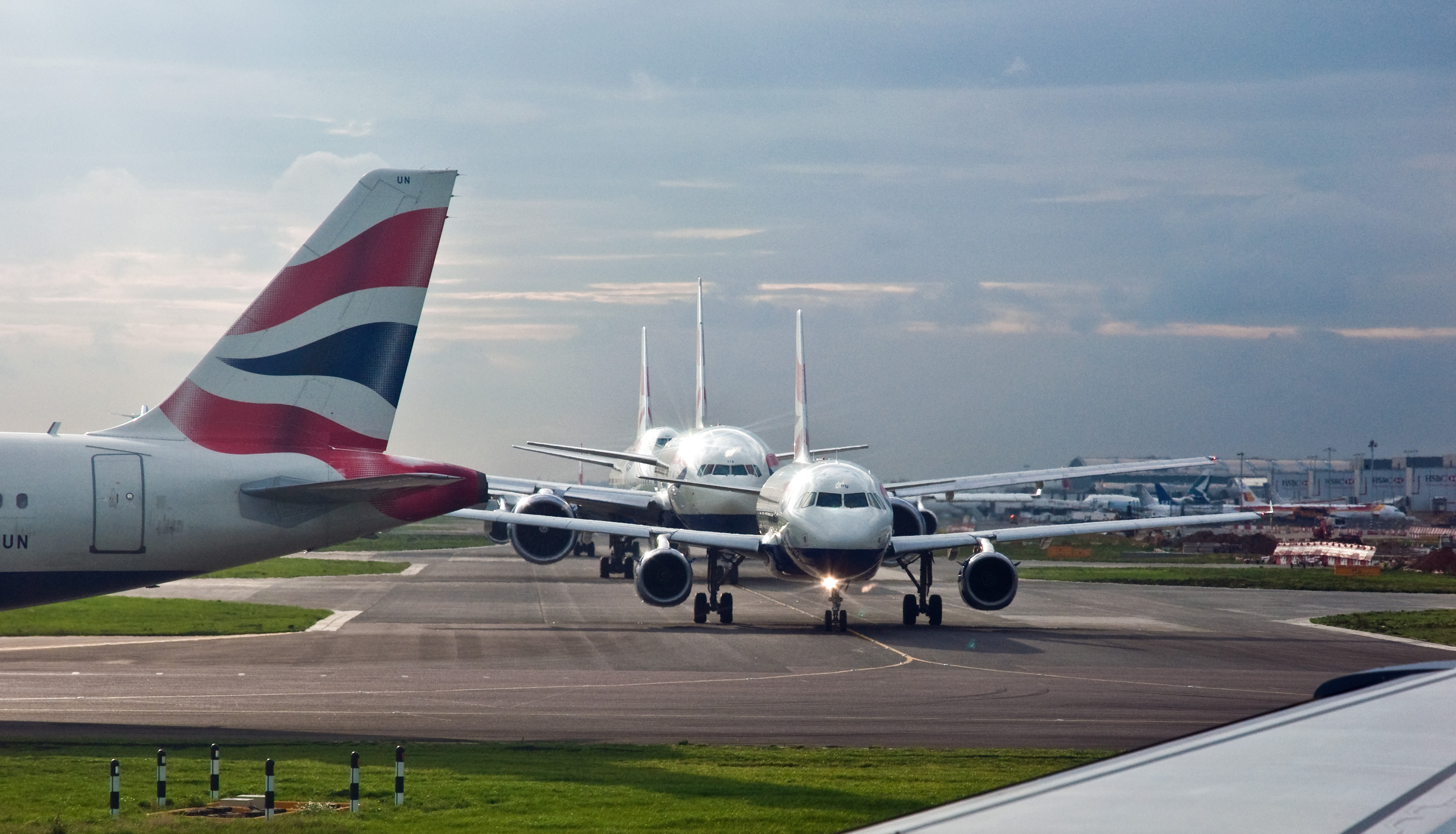 a two airplanes on a runway