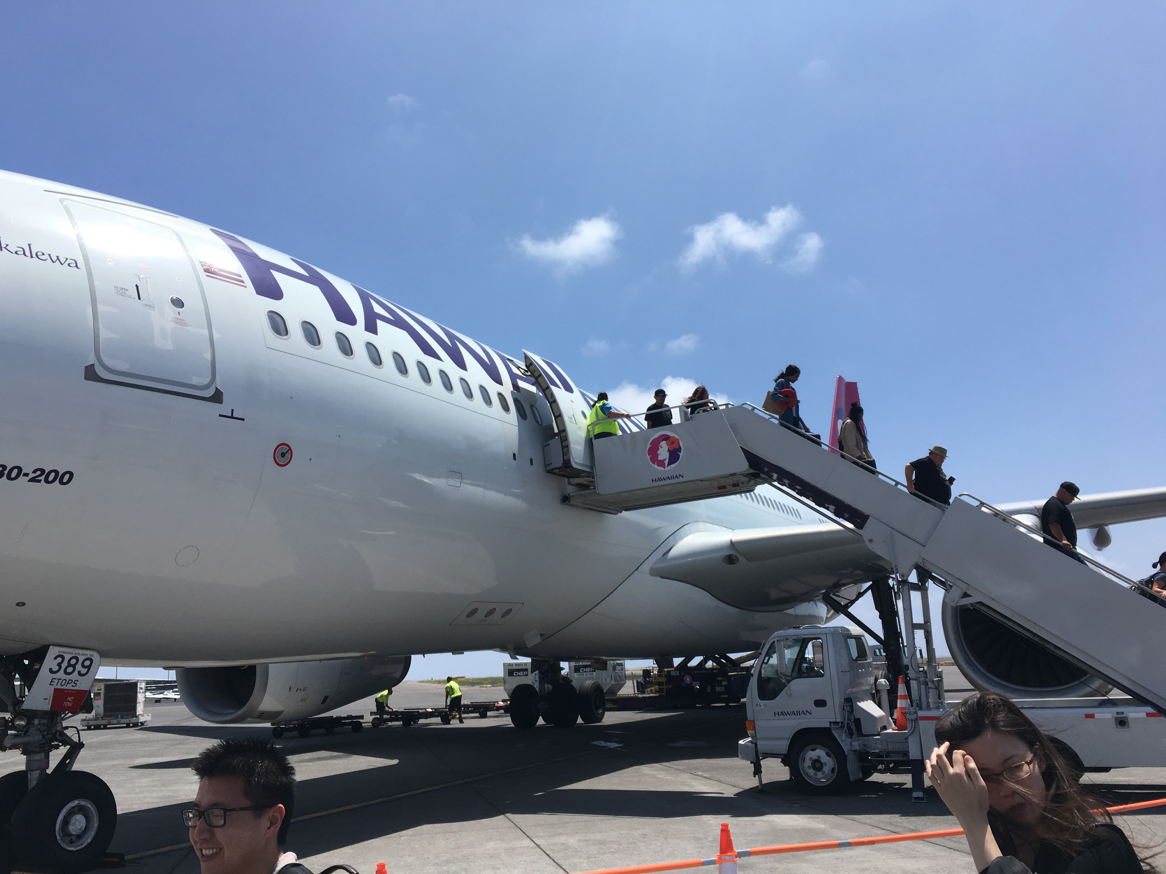 a group of people boarding an airplane