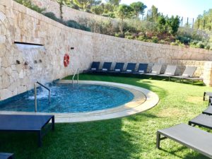 a pool with chairs around it