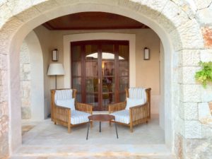 a chair and table in front of a door