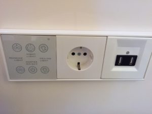 a white outlet with buttons and a usb port