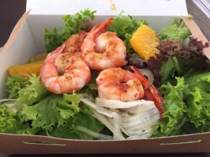 a box of shrimp and salad