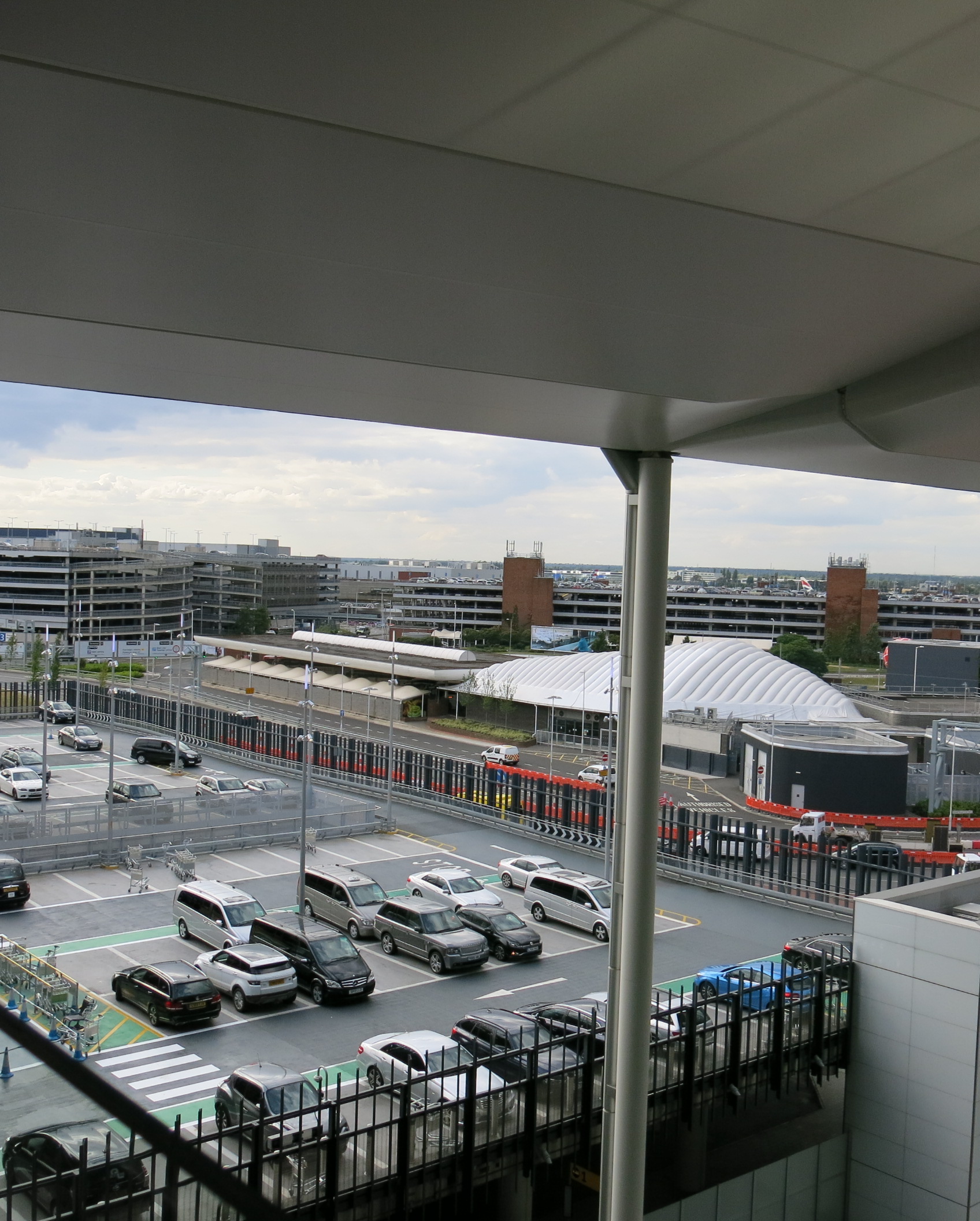 a view from a building to a parking lot