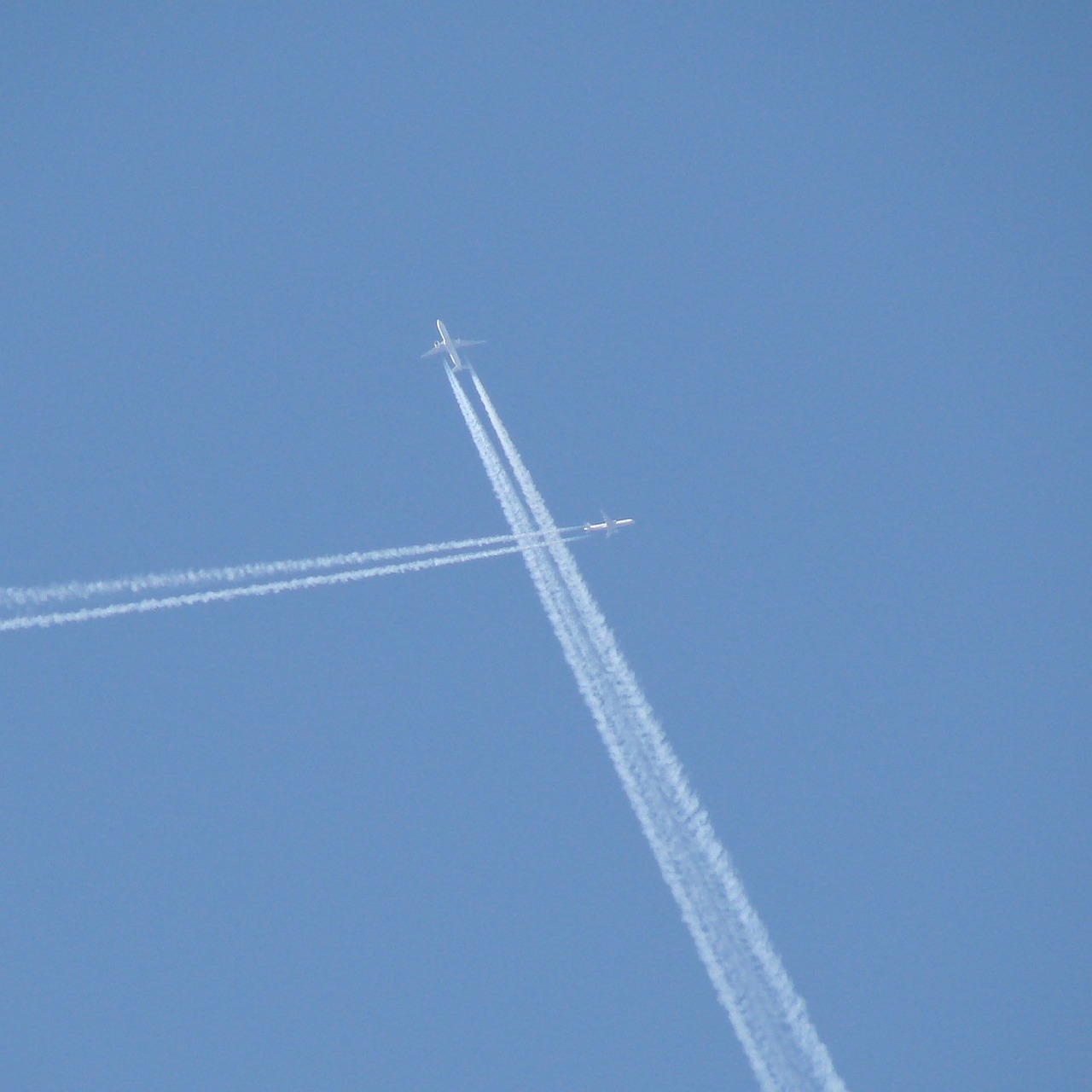 two airplanes flying in the sky