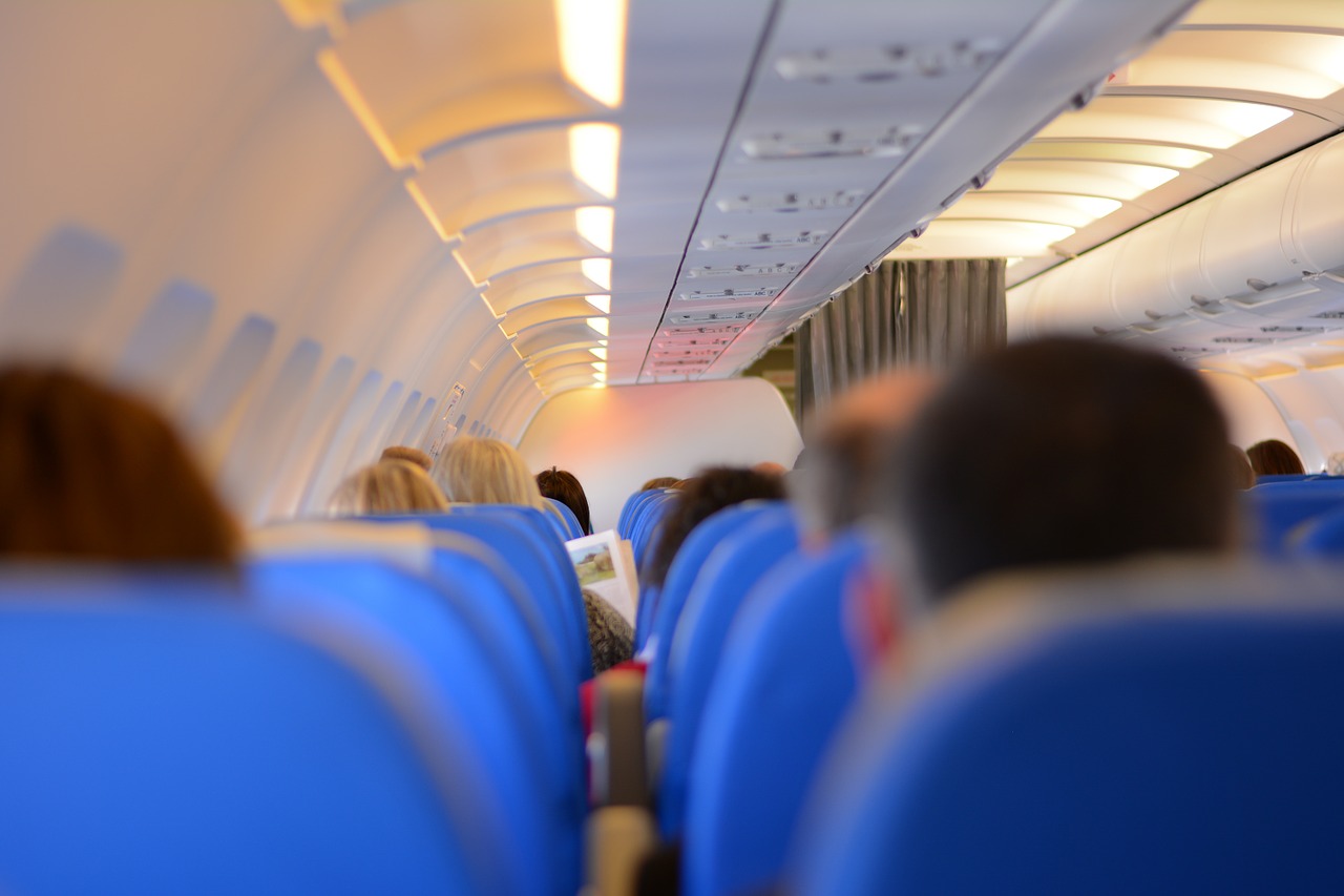 a group of people sitting in an airplane