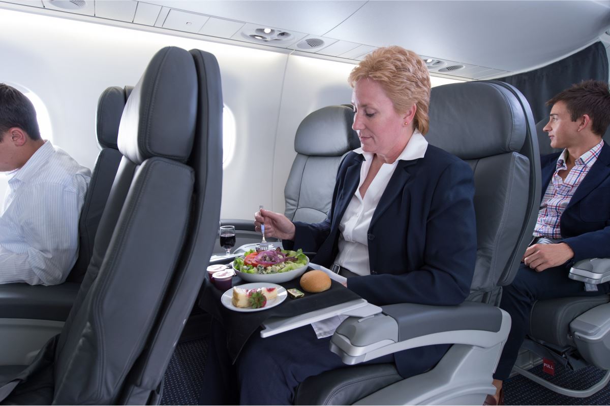 a woman sitting in a chair eating food