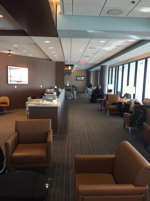 a room with brown chairs and a table