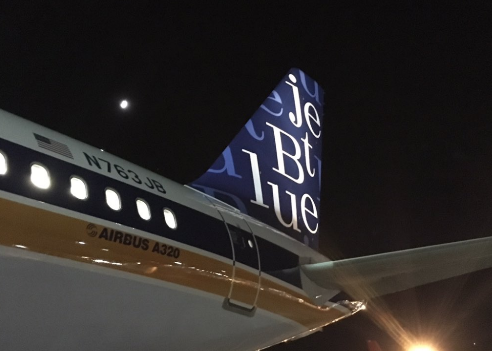 the tail of an airplane at night