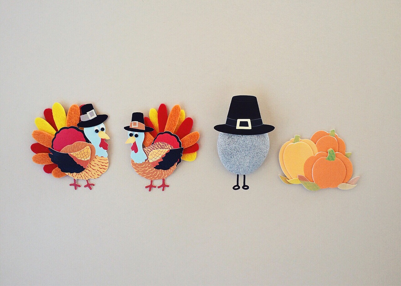 a group of cut out turkeys and pumpkins