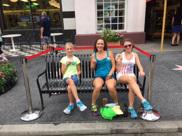 a group of people sitting on a bench